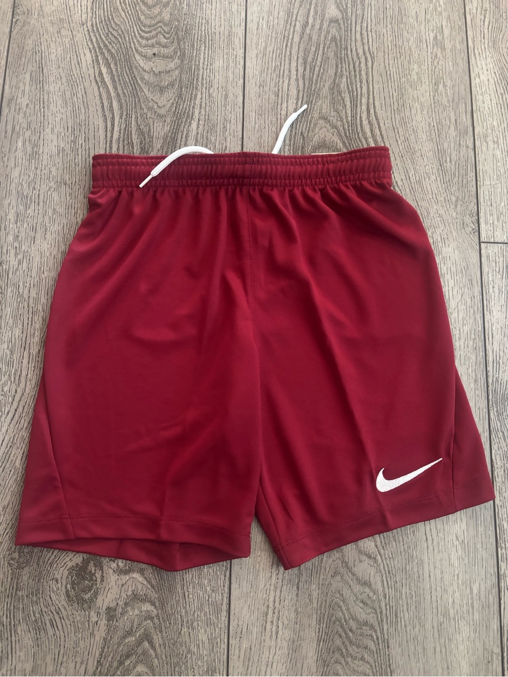 Nike Maroon Athletic Shorts with White Swoosh